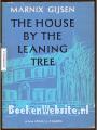 The house by the leaning tree